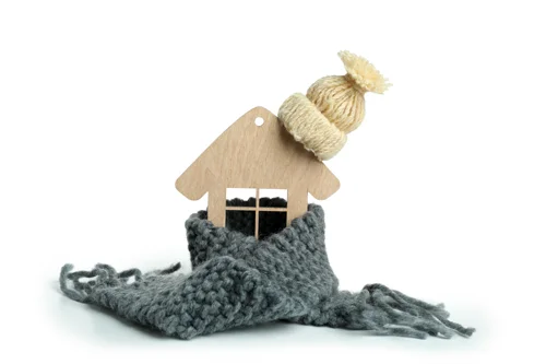 wooden-house-with-knitted-clothes-isolated-on-whit-2023-11-27-05-03-48-utc.webp